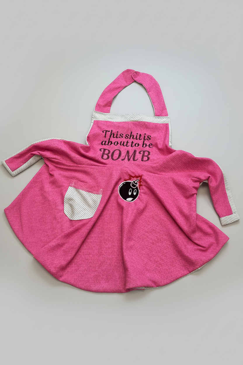 Professional product photo of handmade pink embroidered apron